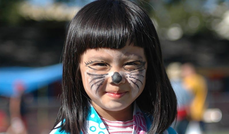 Photo of little girl with her face painted at the 2004 Powell Street Festival, taken by Jon Elder