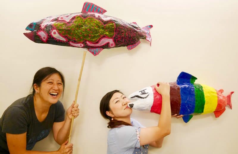 Photo of Kazuho and Kathy with papier mache fish